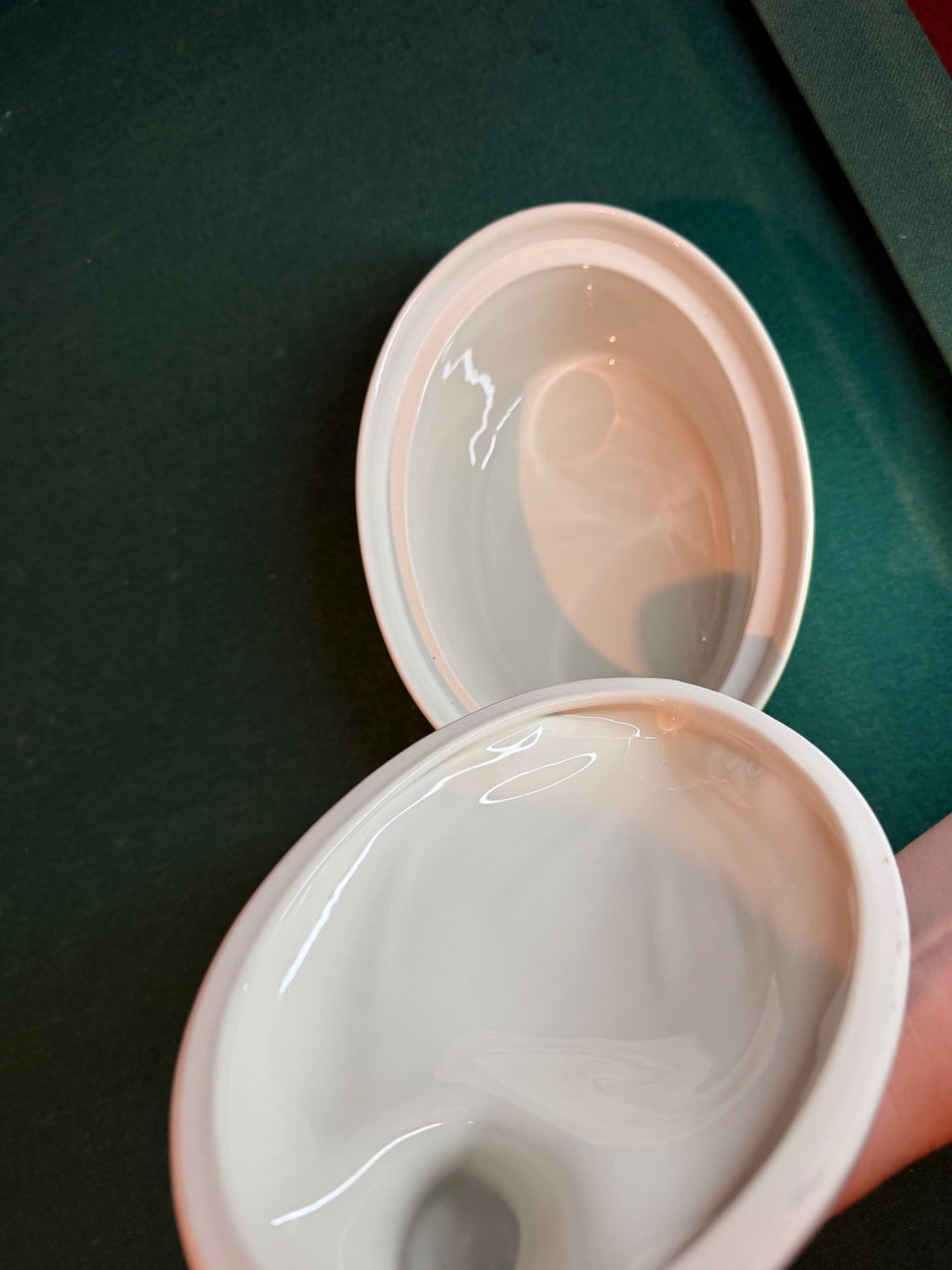 Glazed white ceramic interior of duck dish
